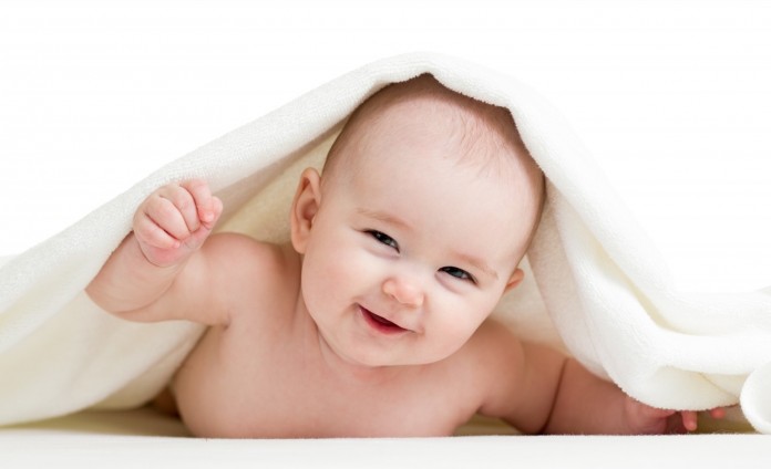 Adorable-happy-baby-in-towel