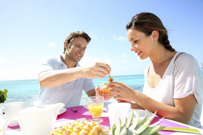 Couple enjoying breakfast in resort